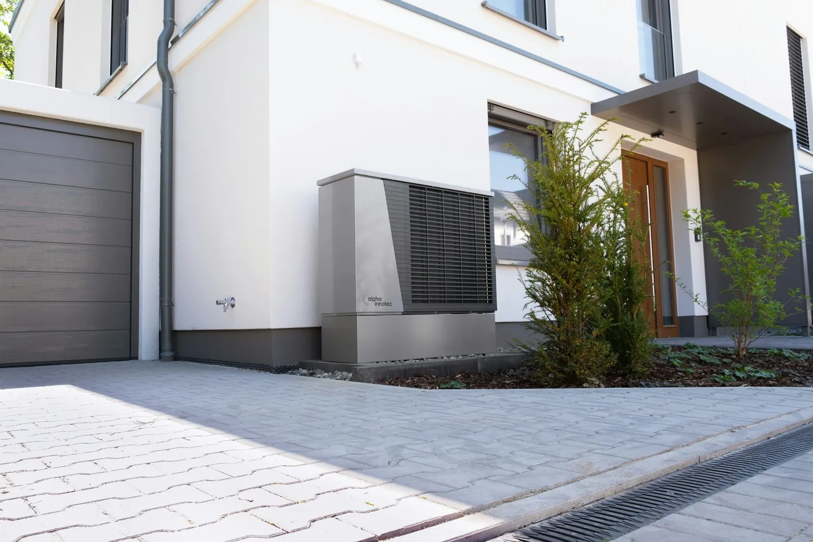 Heat pump unit outside a modern home