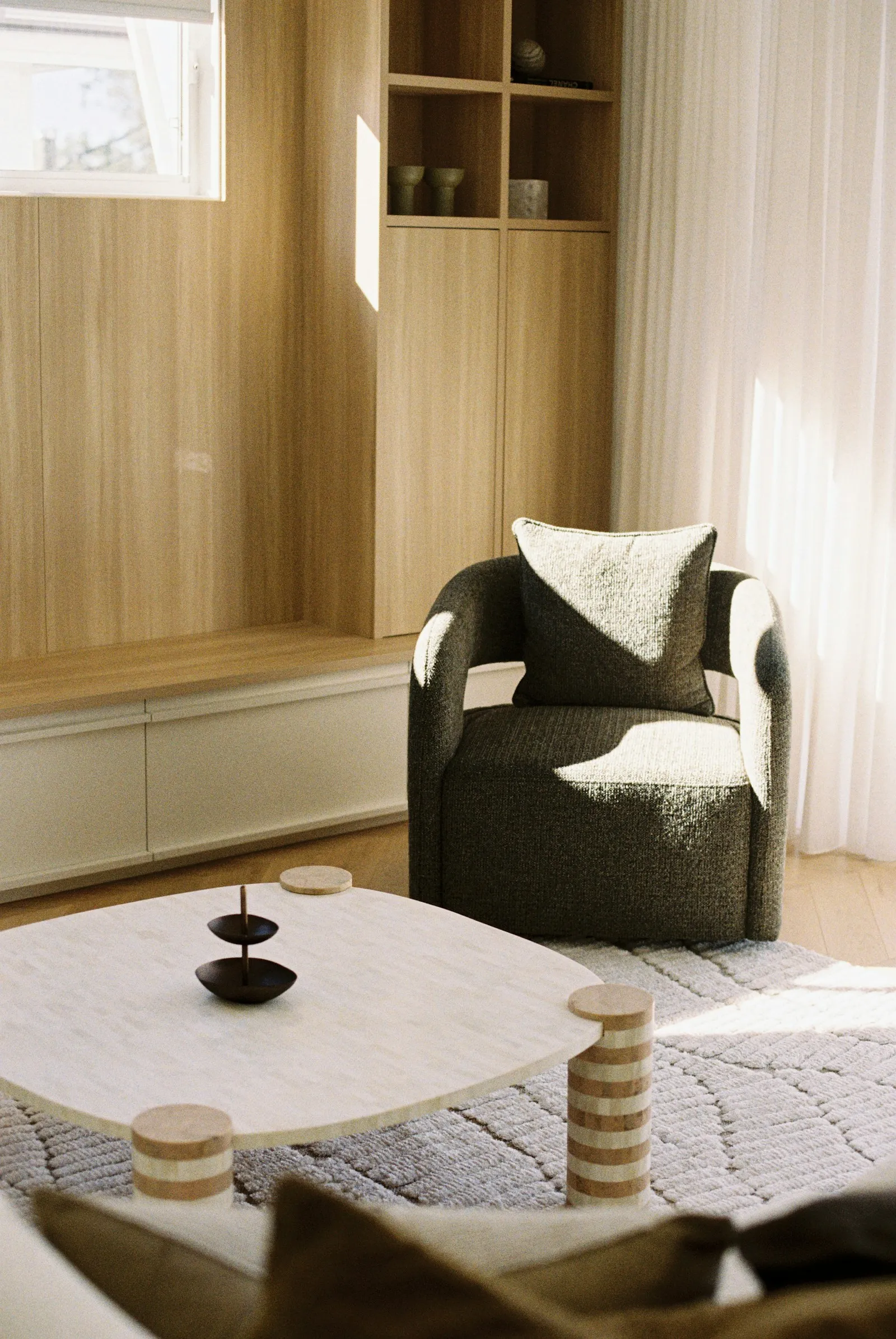 Bright modern living room with armchair and coffee table