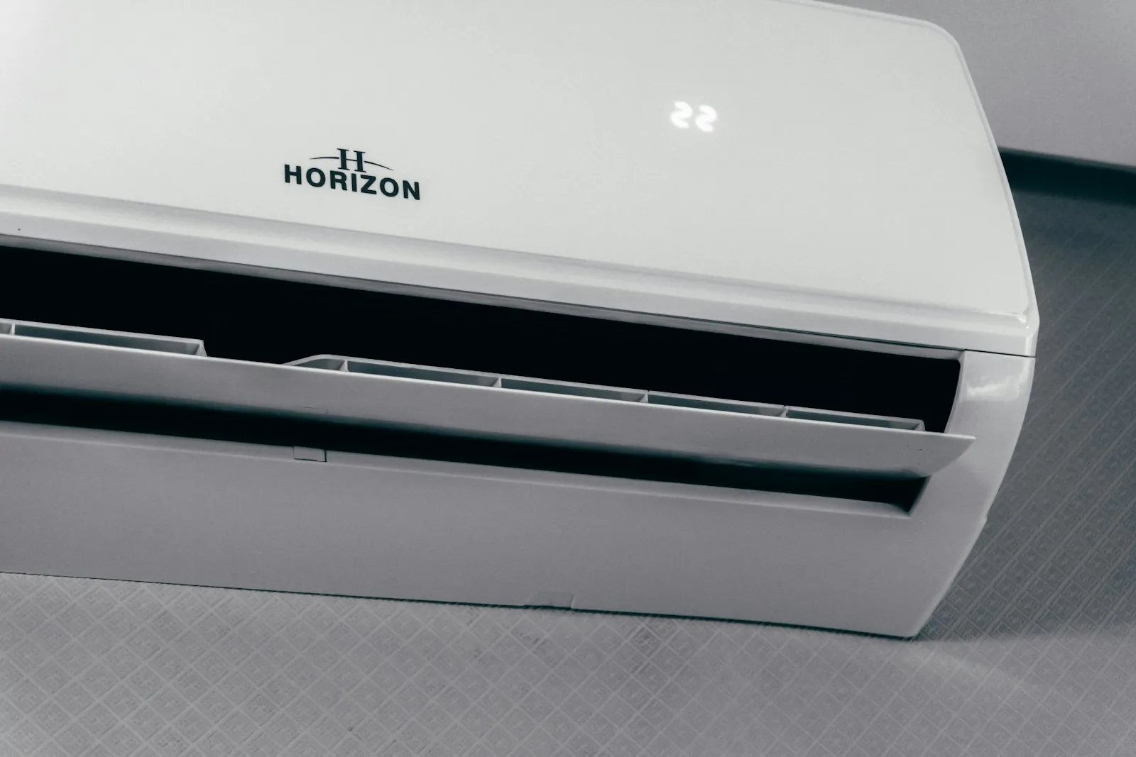Wall-mounted split system air conditioner set to 22 degrees